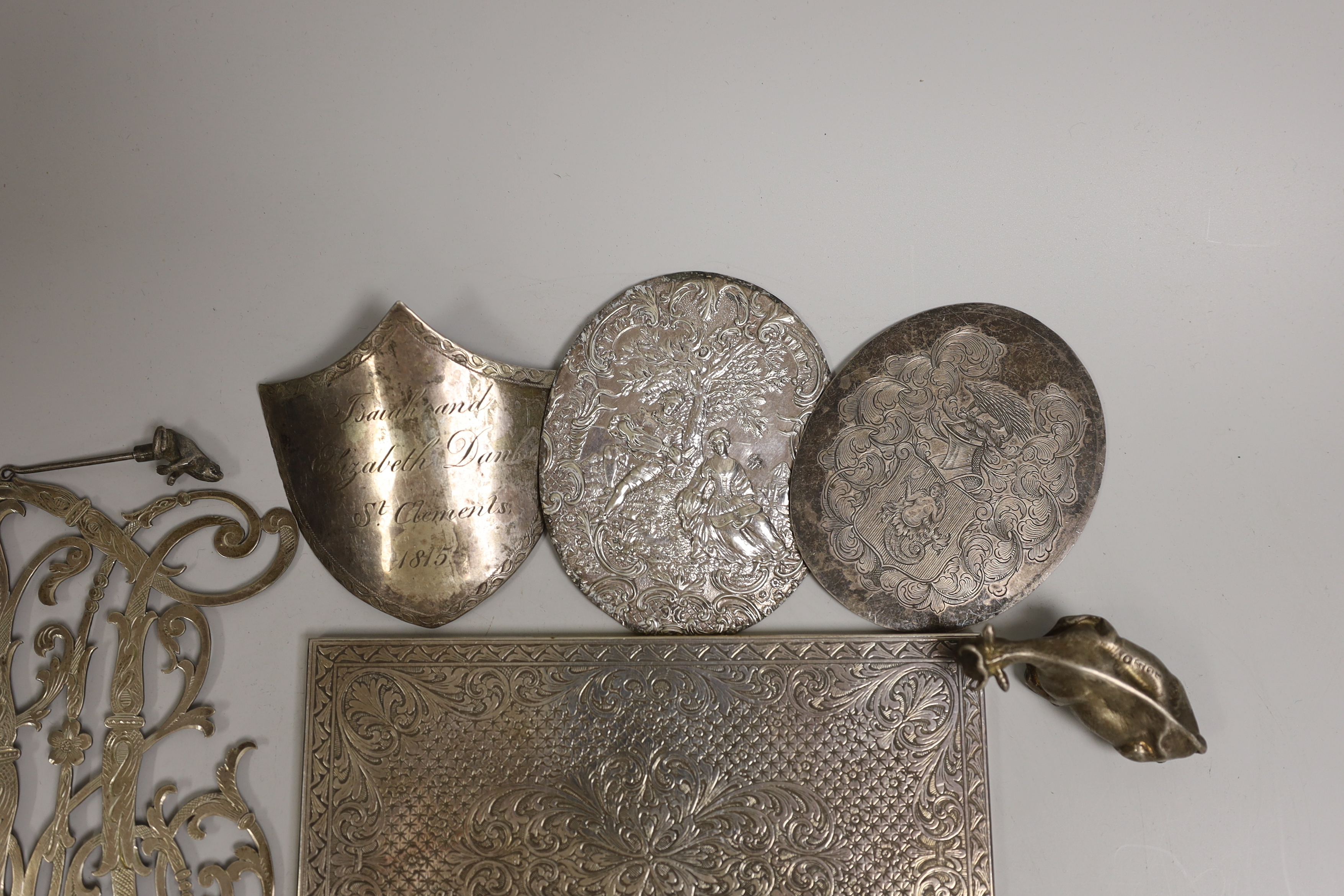 Silver and white metal items including a Swedish monogram appliqué, a Victorian silver butter dish finial, modelled as a cow and four other plaques and mounts, etc.